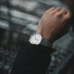 A stylish wristwatch on a man's wrist, showcasing timeless elegance and fashion.
